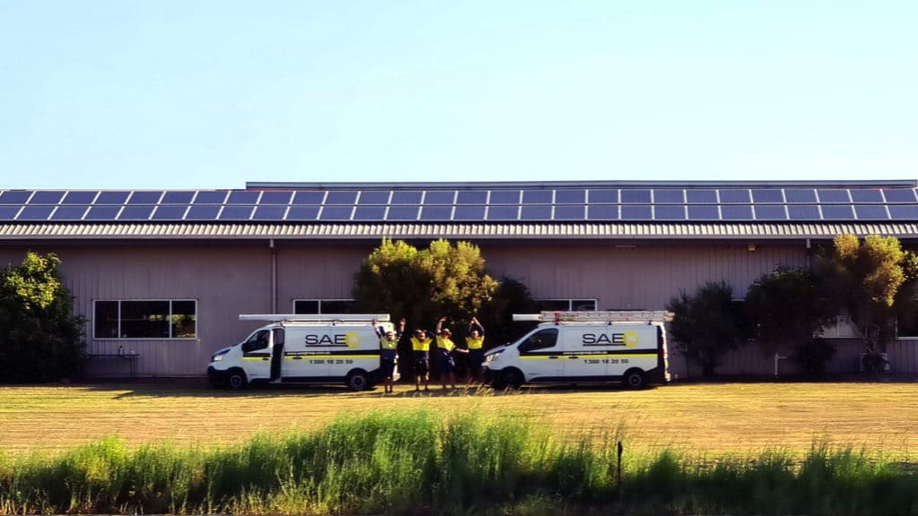 SAE vans in front of house photo