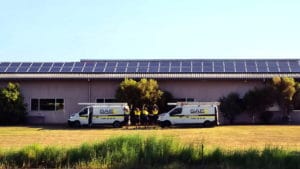 SAE vans in front of house photo